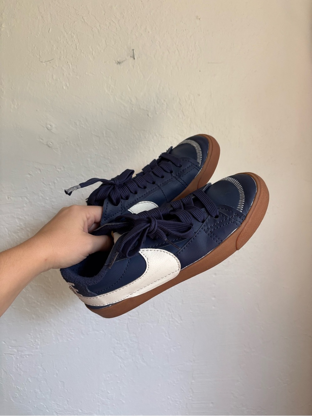 Nike Navy Low-Top Sneakers with White Side Accent and Gum Sole